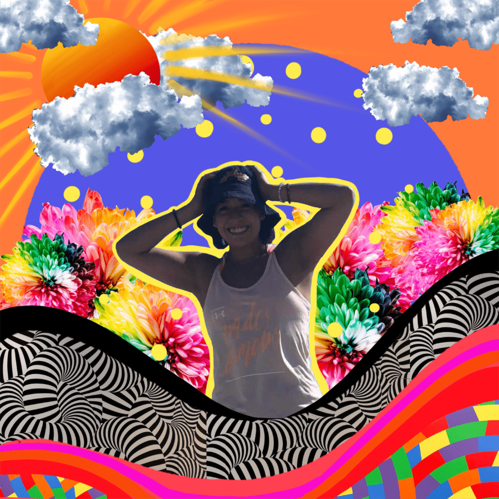 Andy is looking at the camera and laughing. Her hands are on her head and she is wearing a hat. In the backdrop are colorful imagery of flowers, polka dots, stripes, clouds, a rising sun and multicolored boxes and lines
